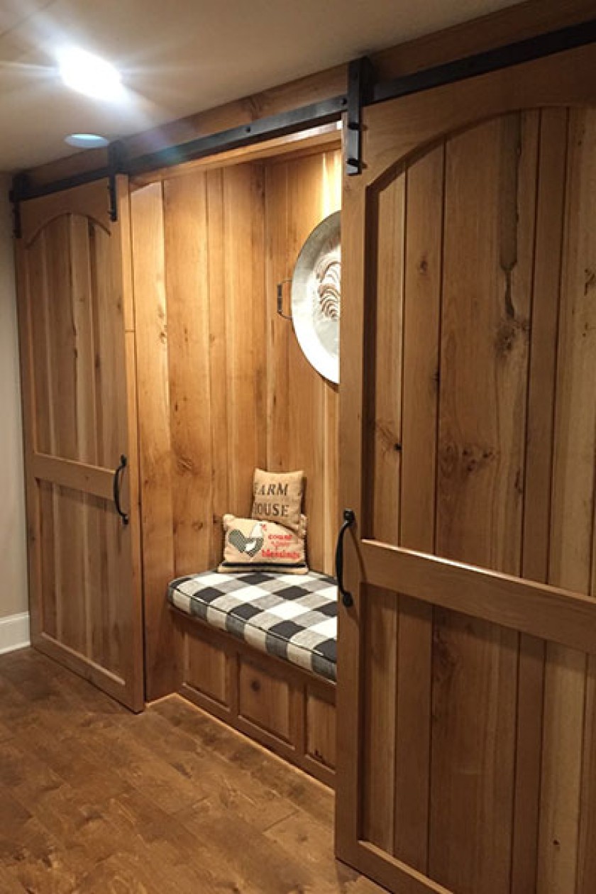 Wooden reading knoock with sliding barn doors.