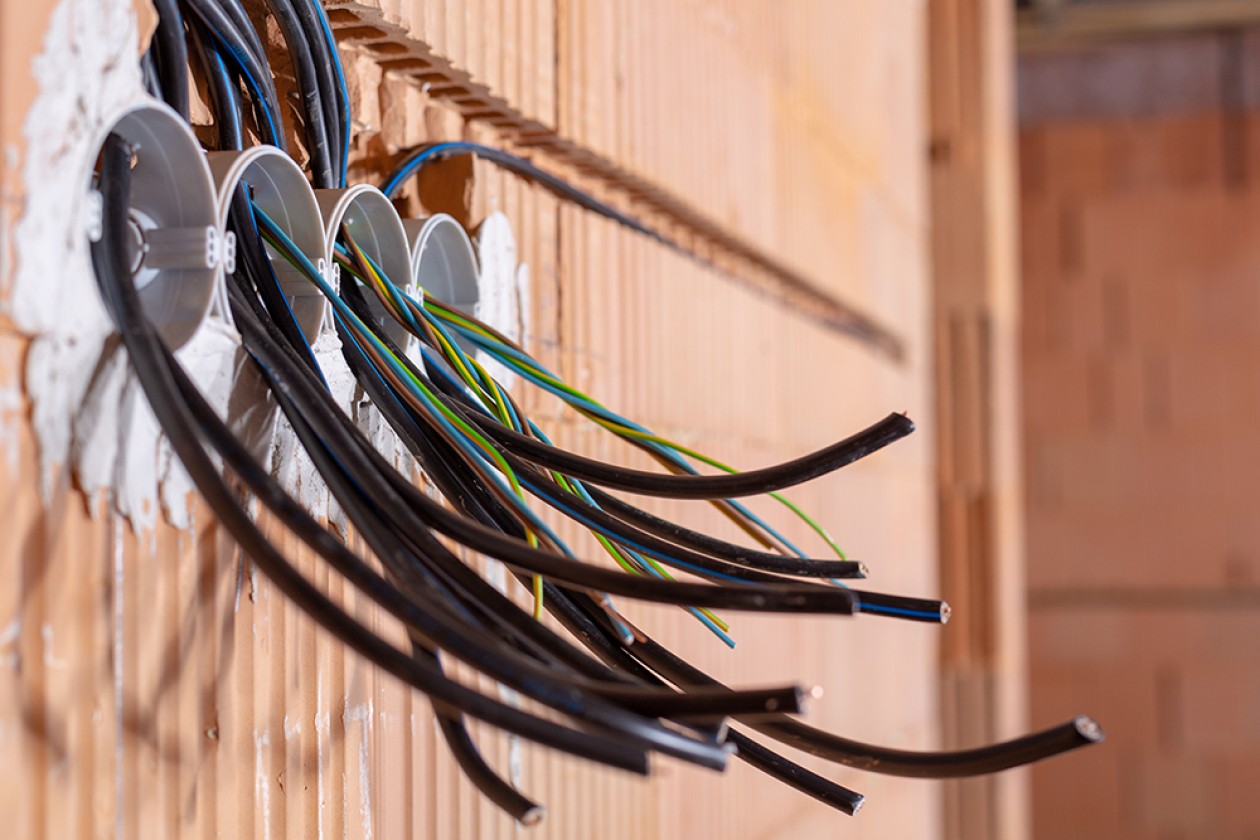 Electrical wiring being installed in a building.